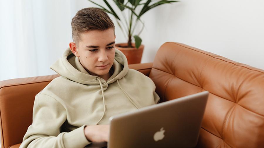 Kid sitting on his computer