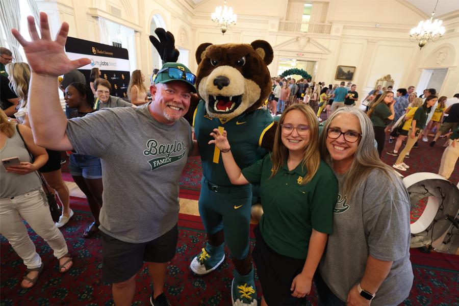 A Baylor Family gathers in Barfield Drawing Room on Family Weekend