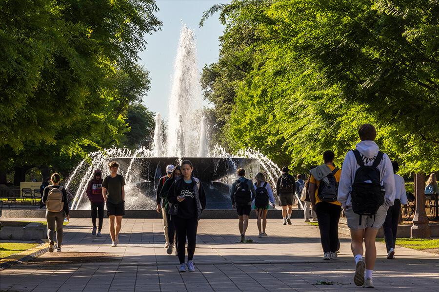students walking on fountain mall